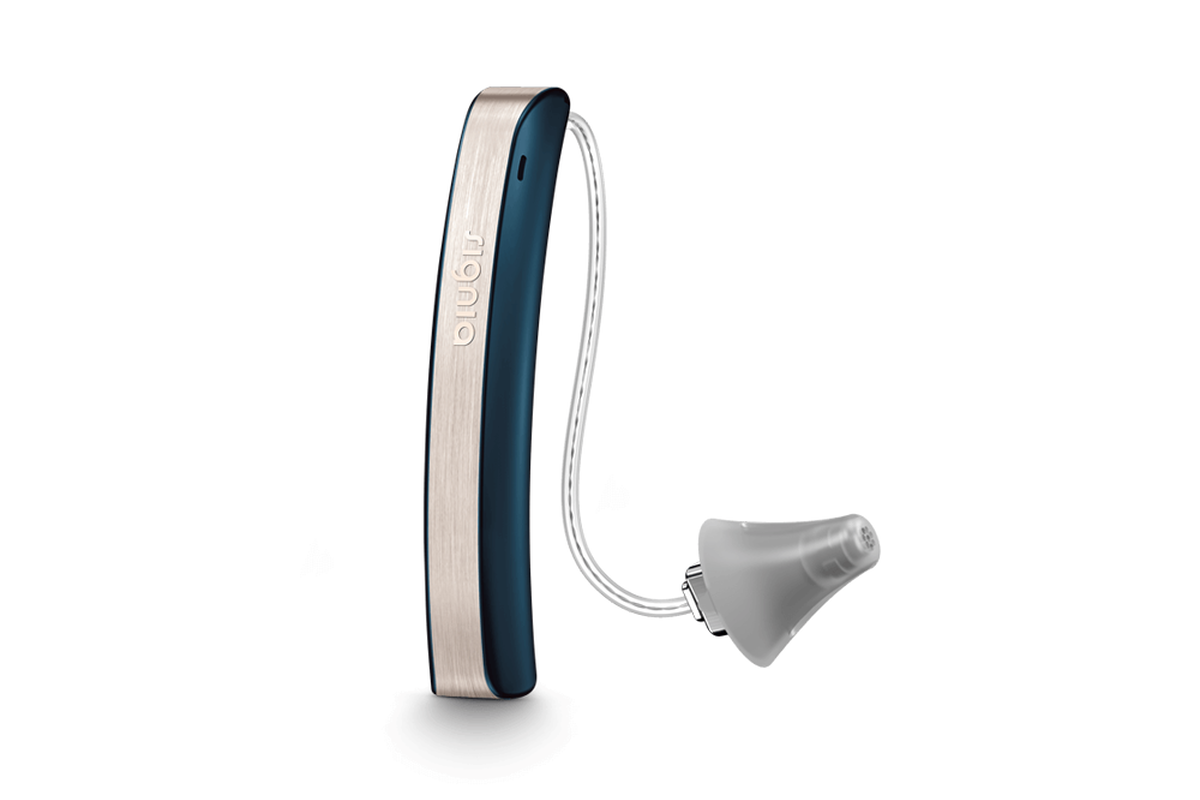 A behind-the-ear hearing aid. If you need help finding the right device for you, contact Expression Audiology.